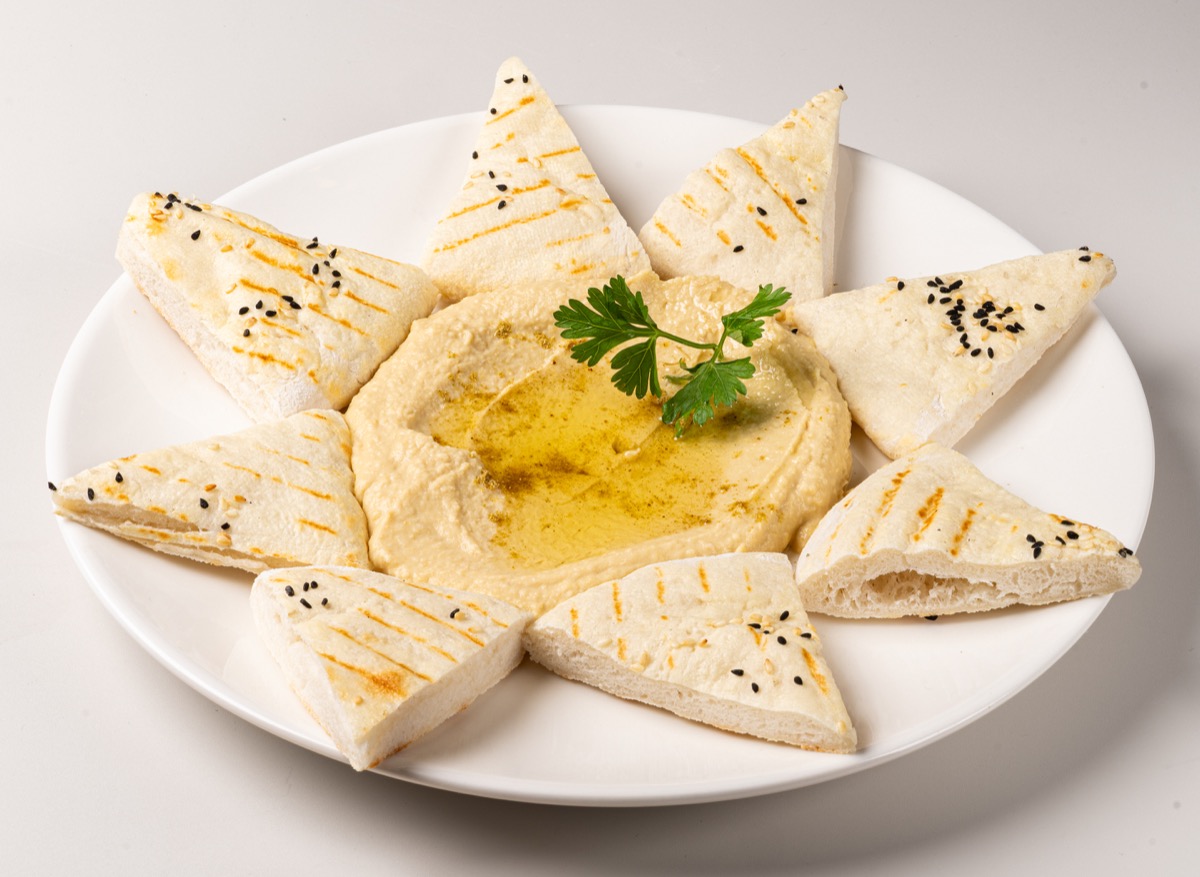 Creamy homemade hummus with warm pita